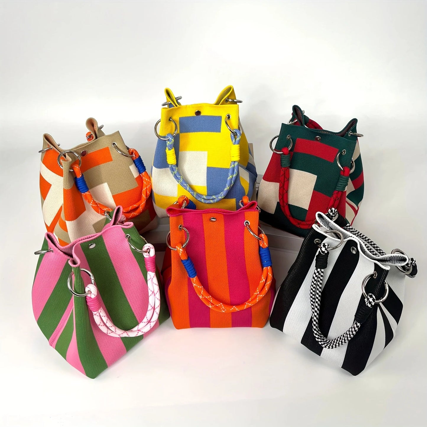 Elegant women's canvas mini bucket bag with chic stripes & patchwork. A versatile shoulder & crossbody fashion accessory.