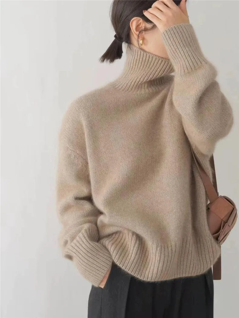 Model wearing a chic women's high-collar sweater, ideal for elegant fall & winter fashion and versatile styling.