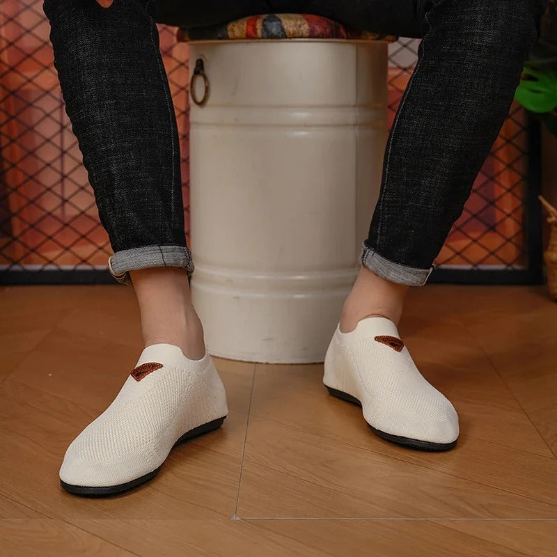 Modern men's AirKnit slip-on shoes. Breathable, lightweight comfort sneakers, perfect for walking.