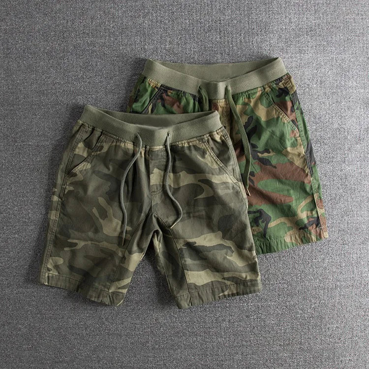 Stylish men's camo shorts with gray & green pattern, designed for comfortable activewear and outdoor versatility.