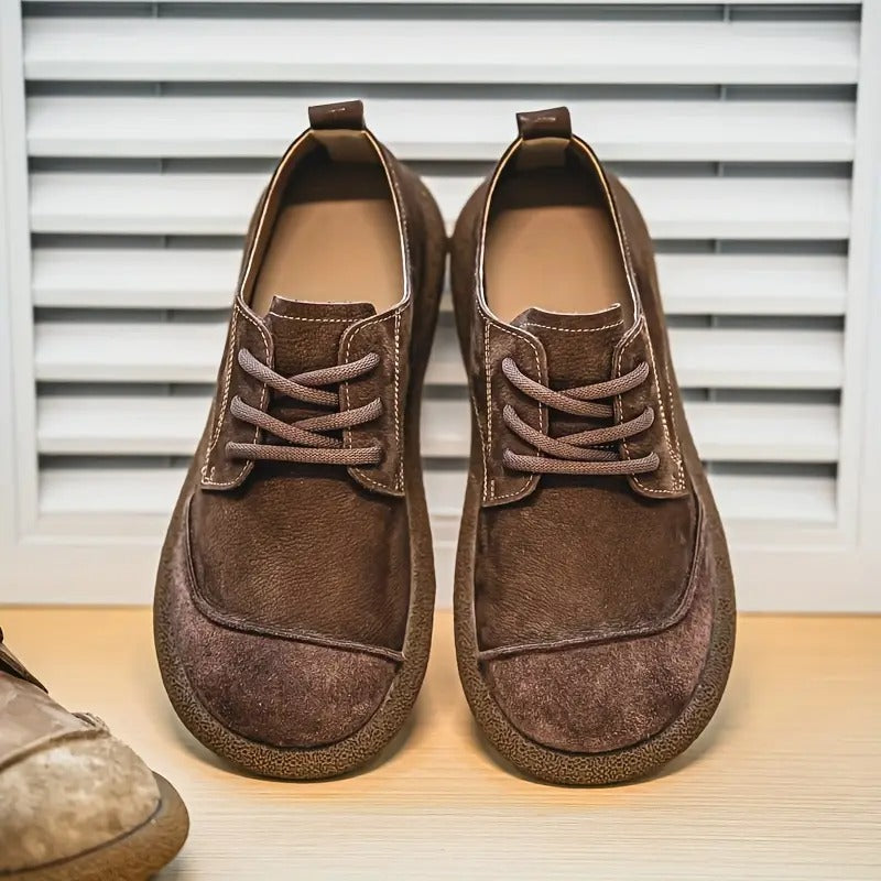 Orthopedic sole detail on men's brown leather casual loafers, designed for superior walking comfort.