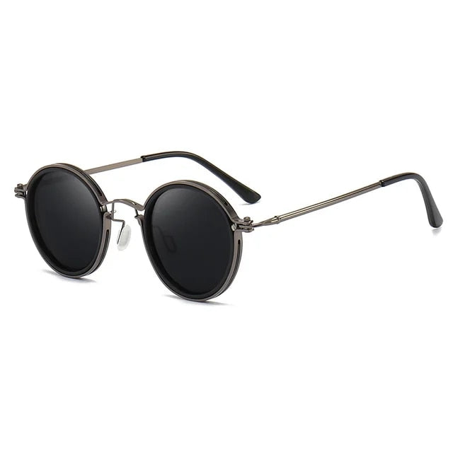 Men's polarized sunglasses for clear vision. Black metal frame, UV protection. Ideal jetset accessory.