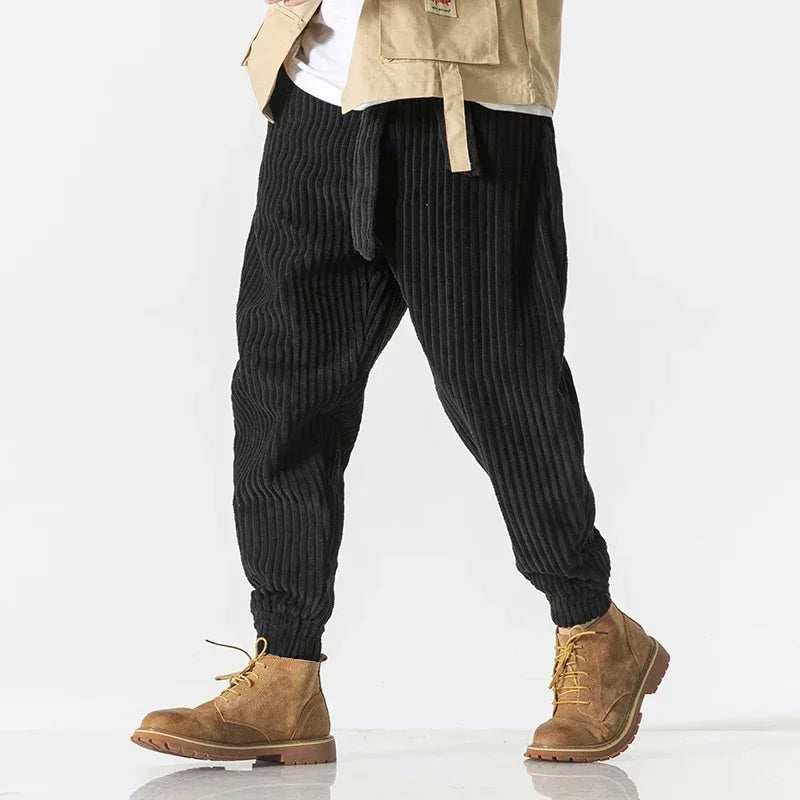 Stylish men's joggers with relaxed fit, perfect for streetwear & comfort. Features elastic waistband & ribbed ankle cuffs.