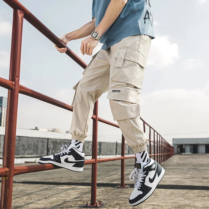 Trendy men's cargo joggers, offering urban comfort and an oversized fit for casual wear.