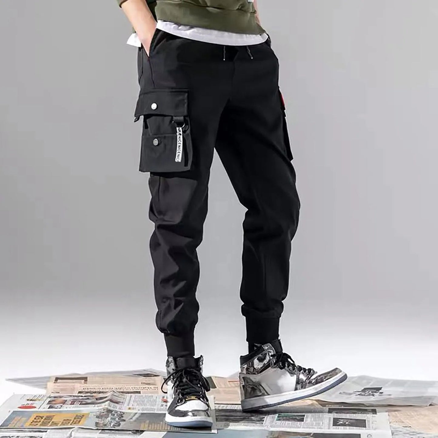 Versatile men's tapered cargo joggers in stealth black. Ideal for streetwear, casual or active comfort.