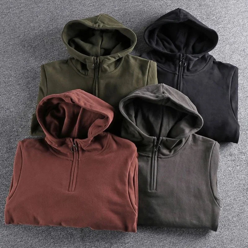 Versatile men's quarter-zip hoodie, combining casual style, comfort & warmth for everyday wear.