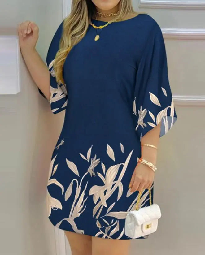 Chic plus size women's dress featuring a vibrant botanical print and a stylish boat neck. Ideal for all-year comfort.