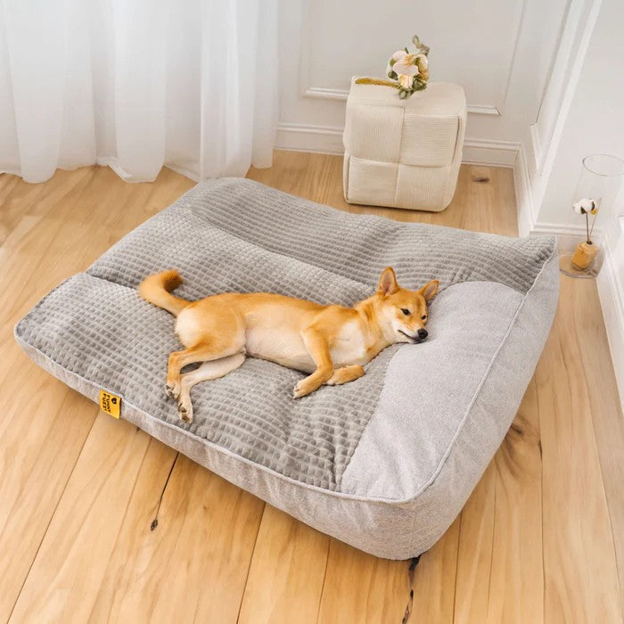 Premium orthopedic dog bed with head pillow, offering plush comfort and superior joint support.