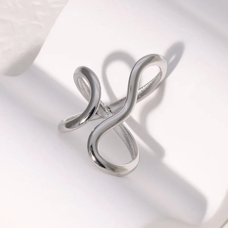 Women's gold wrap infinity ring, adjustable and tarnish-free. Water-resistant, hypoallergenic, and polished for shine.