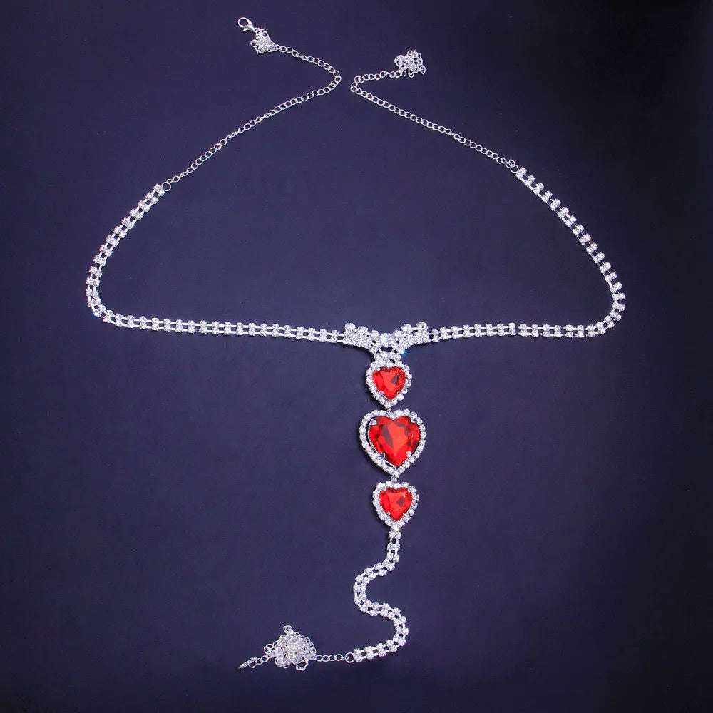 Elegant women's red heart rhinestone body chain, a luxurious and sparkling fashion jewelry accessory.