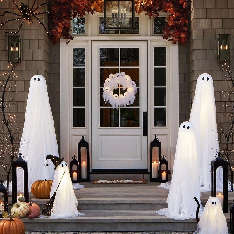 Glowing ghost Halloween wreath with integrated LED lights, creating a spooky and haunted festive decoration.