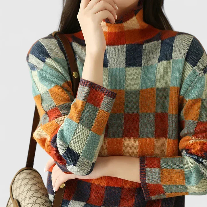 New Arrivals women's cozy check pattern sweater. Effortless autumn style, a must-have multicolored pullover.