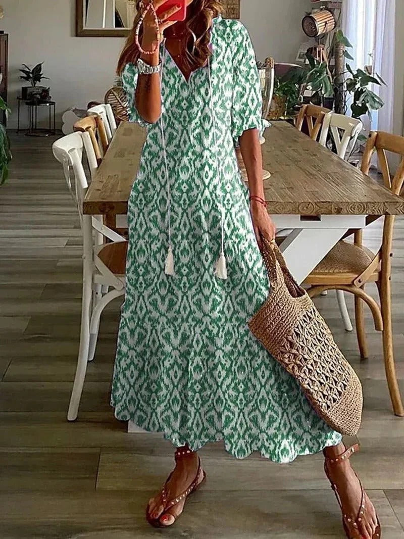 Vibrant women's printed summer midi dress with half sleeves, a stylish choice for any casual outing.