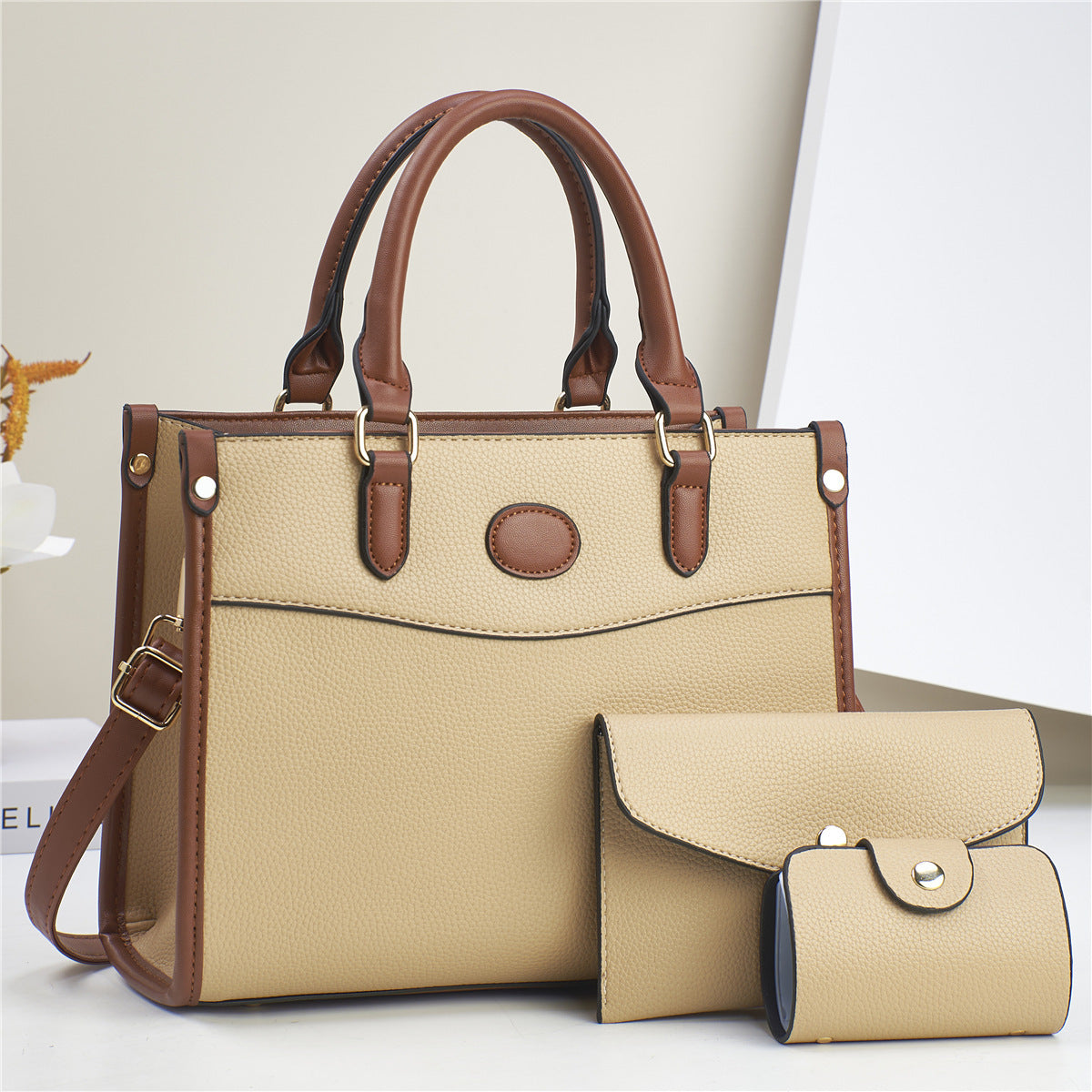 Fashionable Verona Trio 3-in-1 handbag set for women. Tote, shoulder bag, & wallet offer versatile style and function.