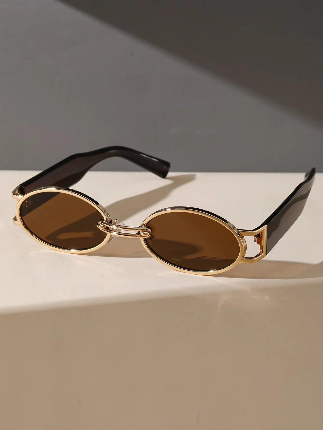 Black and brown AURION oval unisex shades. UV400 protected fashion sunglasses for eye health & style.