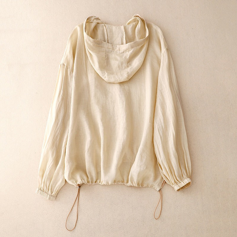 Soft linen hooded shirt, unisex design. Breathable and lightweight, an ideal summer top for casual comfort and style.