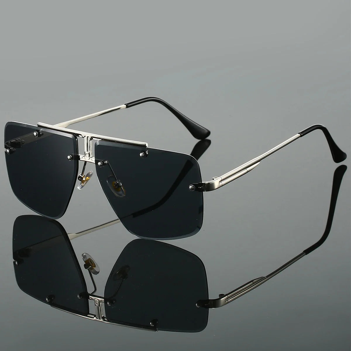 Protective unisex rimless square sunglasses for ultimate UV protection. Stylish and modern eyewear accessory.
