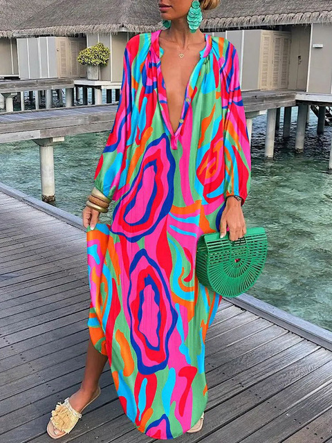 Casual women's floral maxi dress with a vibrant bohemian print, great for summer and vacation fashion.