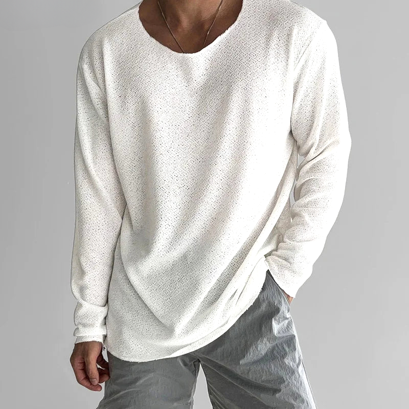 Women's black casual long-sleeve tee. Soft, breathable, & lightweight for everyday comfort & relaxed fit.