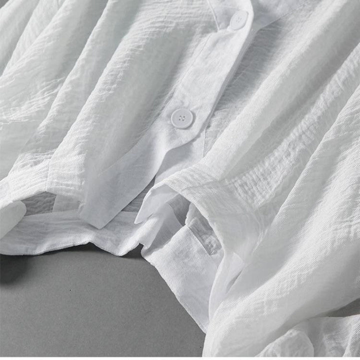 Textured women's blouse with voluminous balloon sleeves, a chic & breezy top for casual or elegant looks.