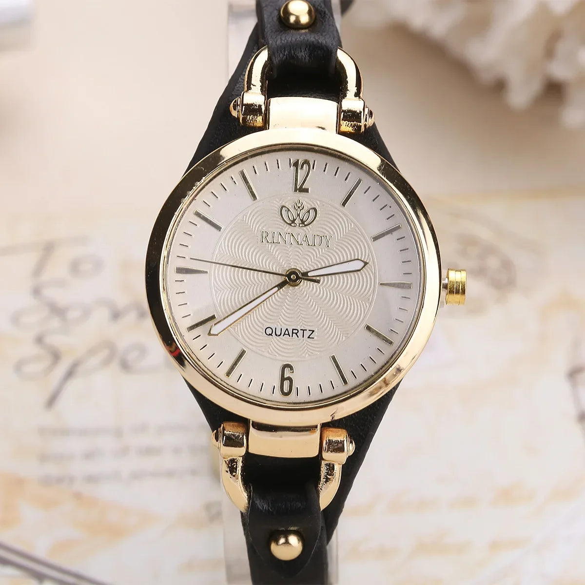 Classic women's gold quartz watch, timeless design with a comfortable vegan leather strap. Versatile accessory.