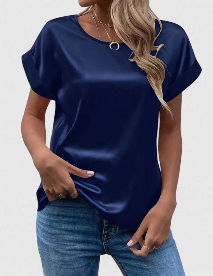 Chic women's loose-fit blouse with elegant batwing sleeves and a classic o-neck, ideal for summer fashion.