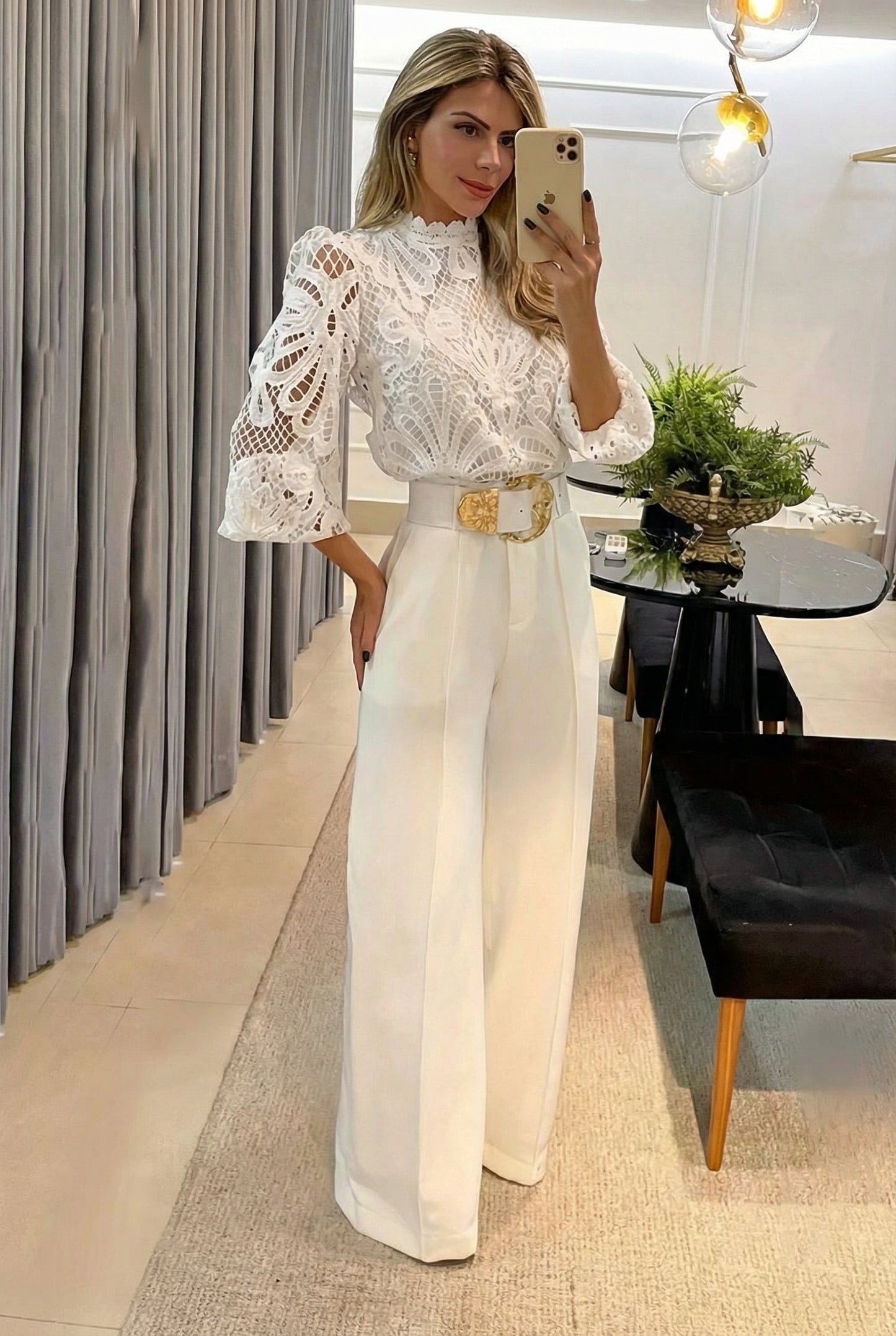 Modern women's sheer blouse & tailored high-waist pants set. Versatile for elegant formal, office, or events.