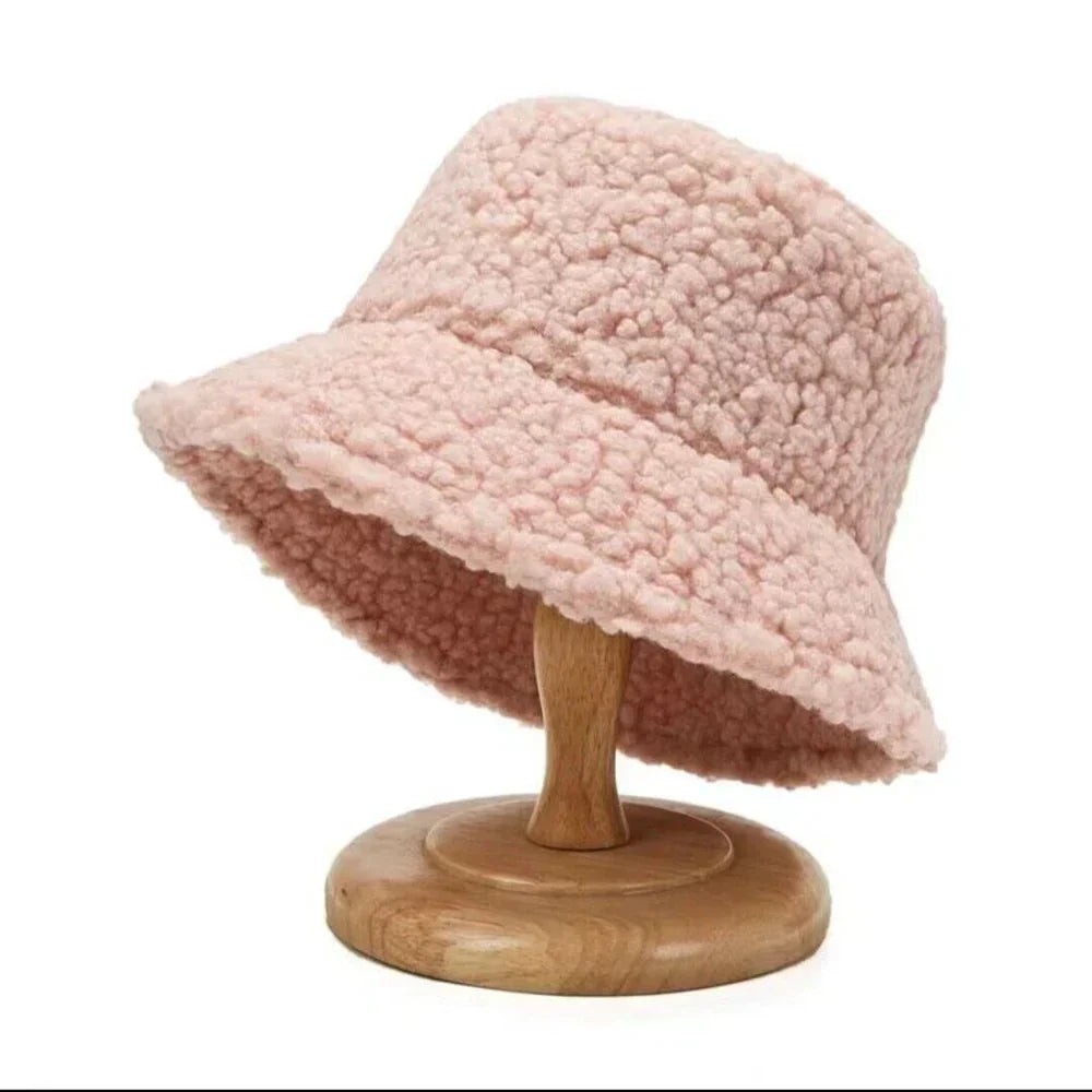 Cozy women's plush bucket hat, a trendy faux fur accessory for your cold weather winter outfit.