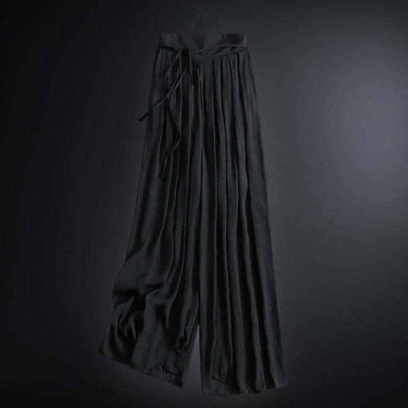 Lightweight women's flowy wide-leg summer pants with a flattering high waist and adjustable tie. Effortlessly stylish.