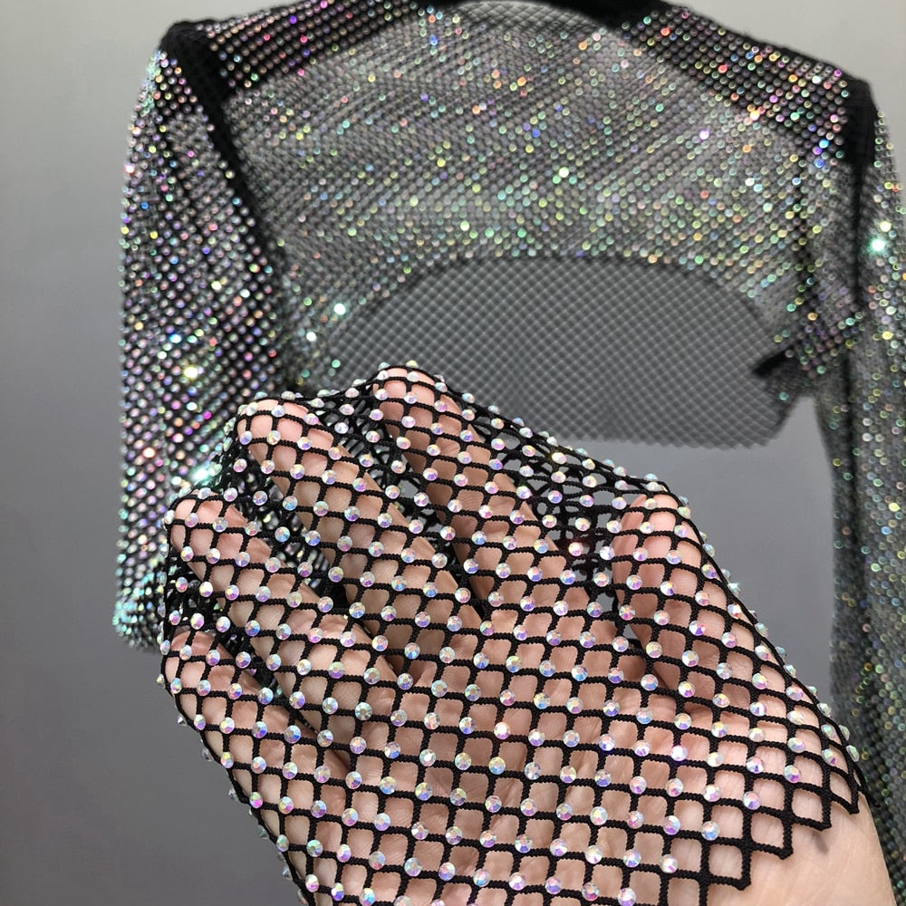 Elegant women's sheer rhinestone top, featuring glitter & sparkle for a glamorous party or night out.