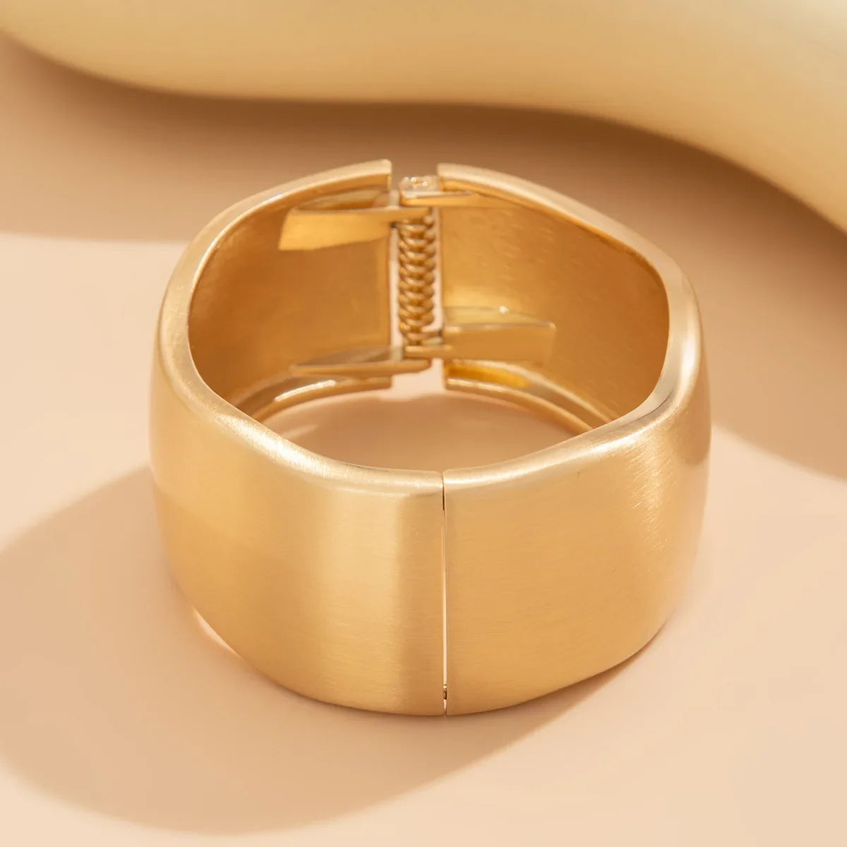 Fashionable women's gold tone wave cuff bracelets. 4-piece stackable set, vintage-inspired bangles for everyday style.