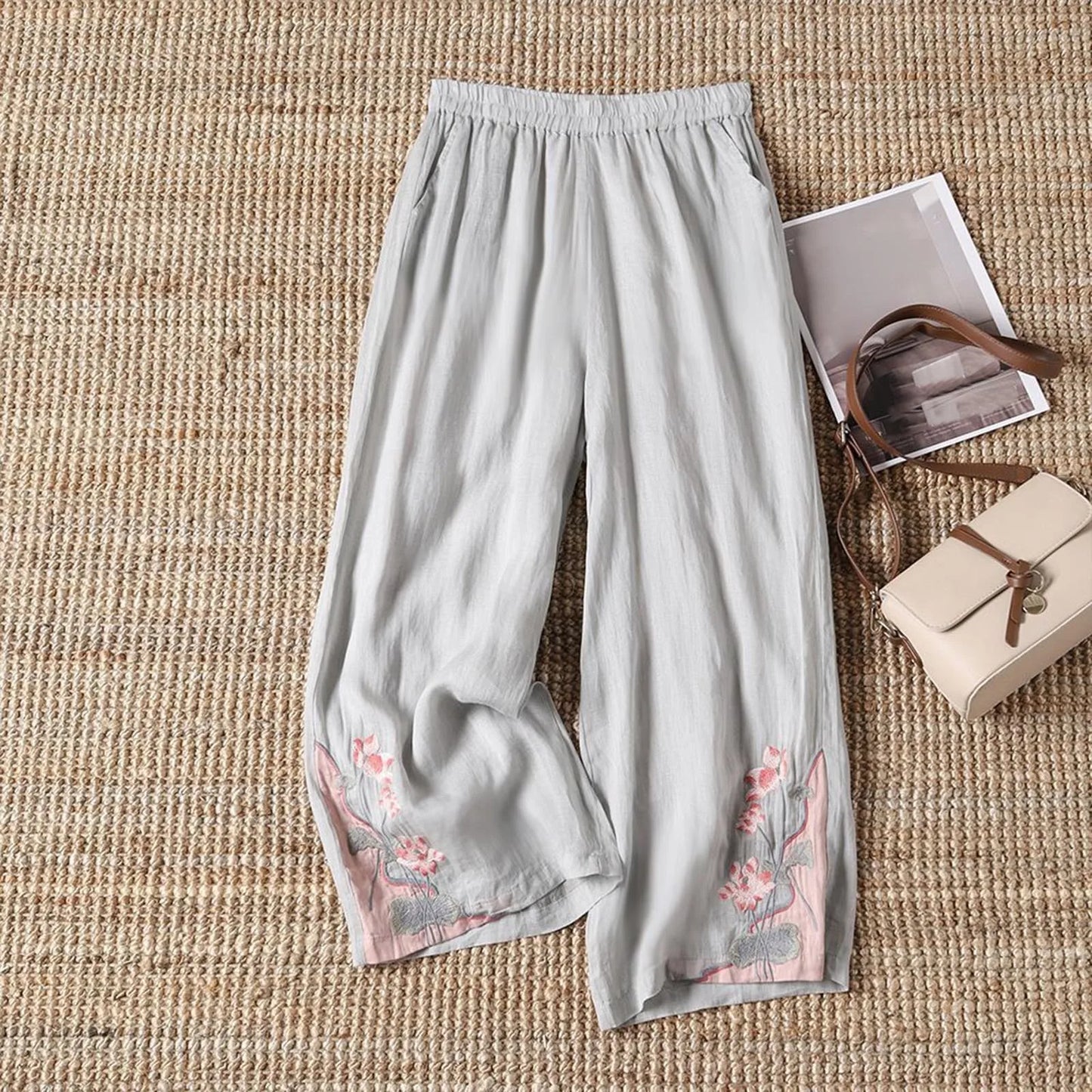 Versatile women's summer trousers featuring a delicate floral print, made from soft, breathable cotton.
