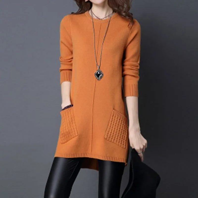 Full view of a cozy women's Madison midi sweater dress, showcasing relaxed fit, cable knit texture & functional pockets.