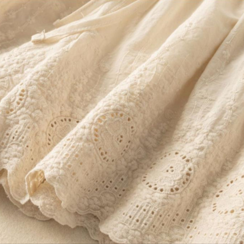 Stylish Nova women's beige embroidered shorts. Comfortable drawstring design for casual summer wear.