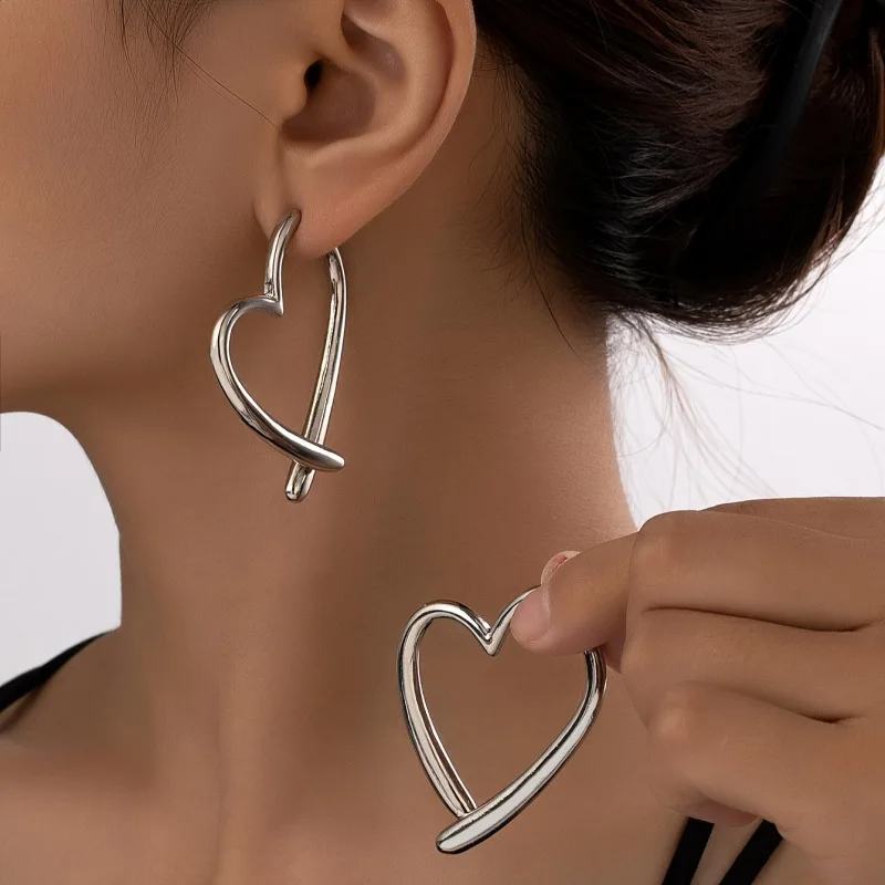 Chic women's heart hoop earrings with polished finish. Trendy non-tarnish fashion jewelry, a perfect stylish accessory.