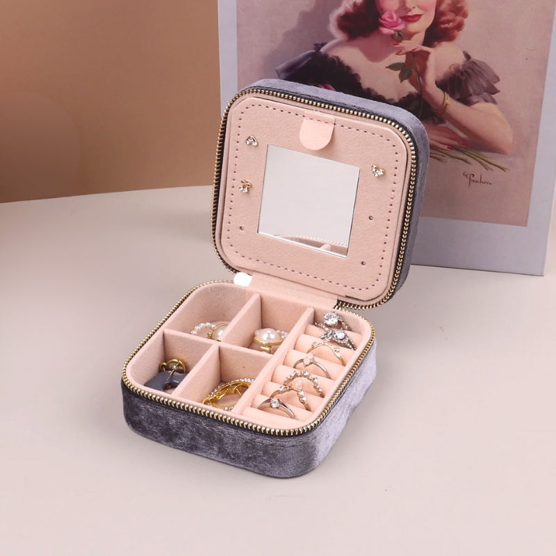 Women's portable velvet jewelry organizer, perfect for elegant accessory storage during travel.