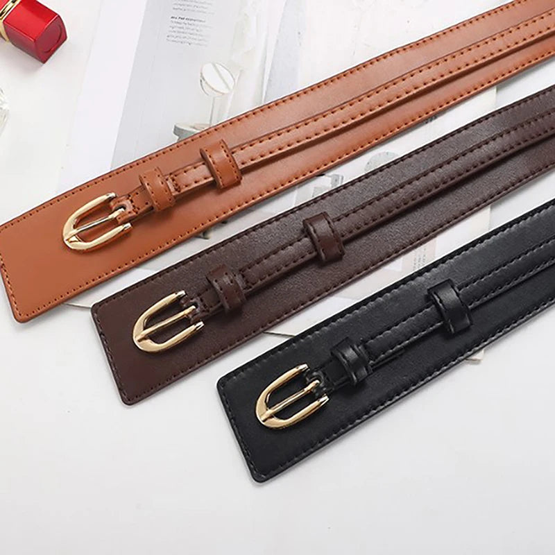 Women's fashion accessory: dual-strap vegan leather waist belt, available in tan, brown, black.