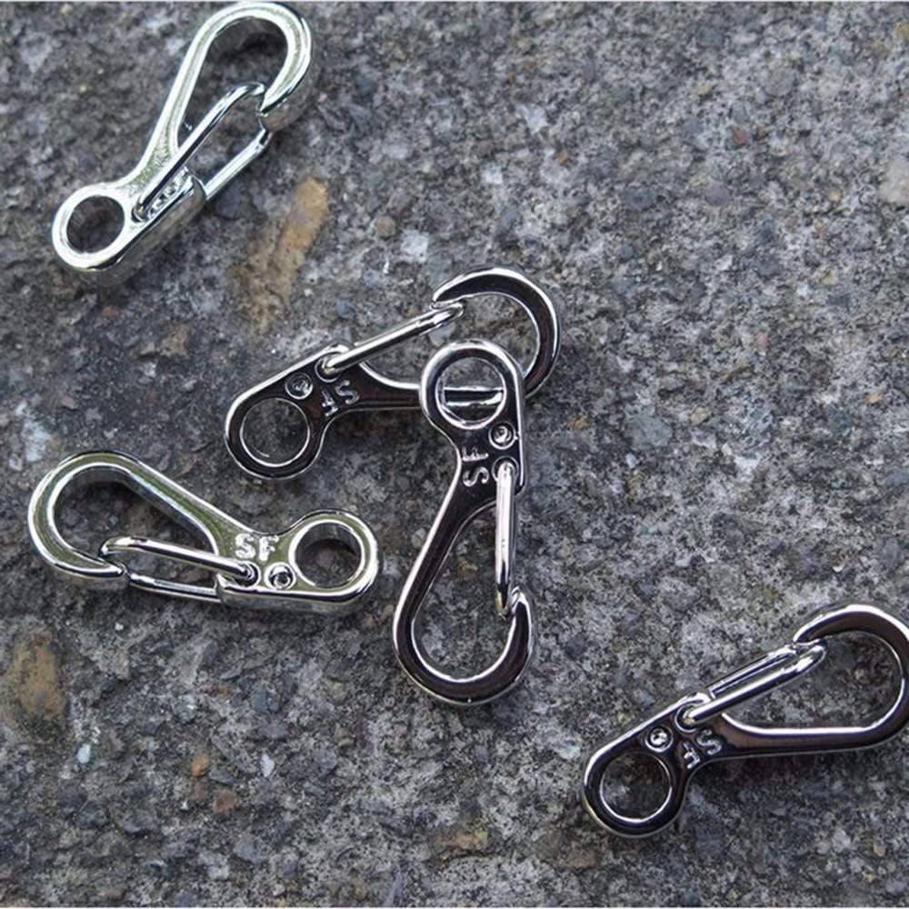 Stack of 10 durable mini SF spring clasps, ready for use as backpack clips or survival gear
