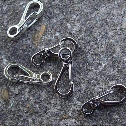 Stack of 10 durable mini SF spring clasps, ready for use as backpack clips or survival gear
