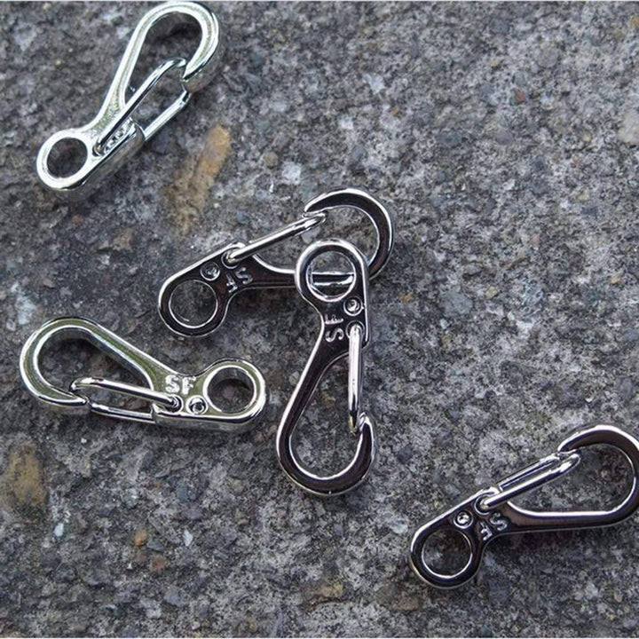 Stack of 10 durable mini SF spring clasps, ready for use as backpack clips or survival gear