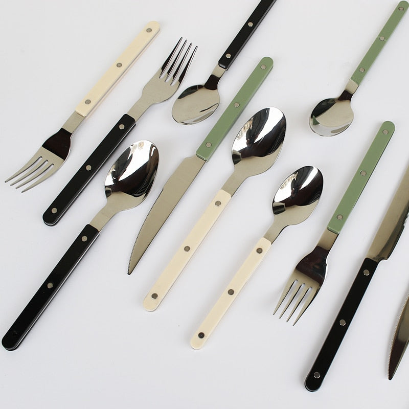 Elegant 24-piece stainless steel flatware set, featuring a beautiful engraved design for stylish dining.