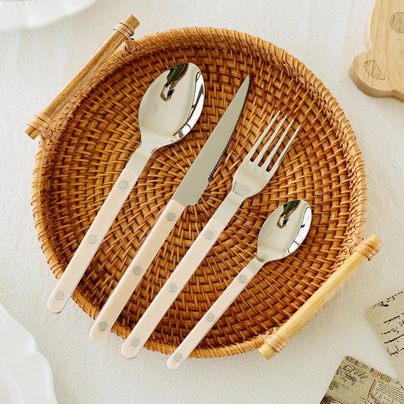 Premium 24-piece stainless steel utensil set with unique engraved patterns for your kitchenware.