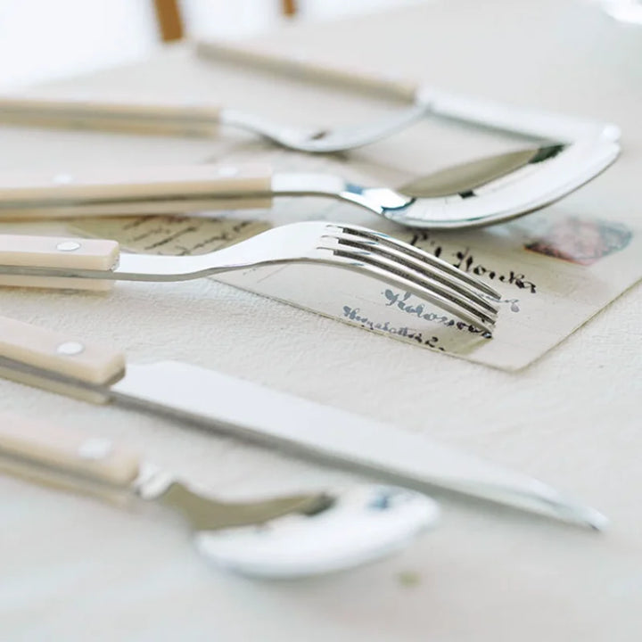 Complete 24-piece stainless steel utensil set with an exquisite engraved design, great for home decor.