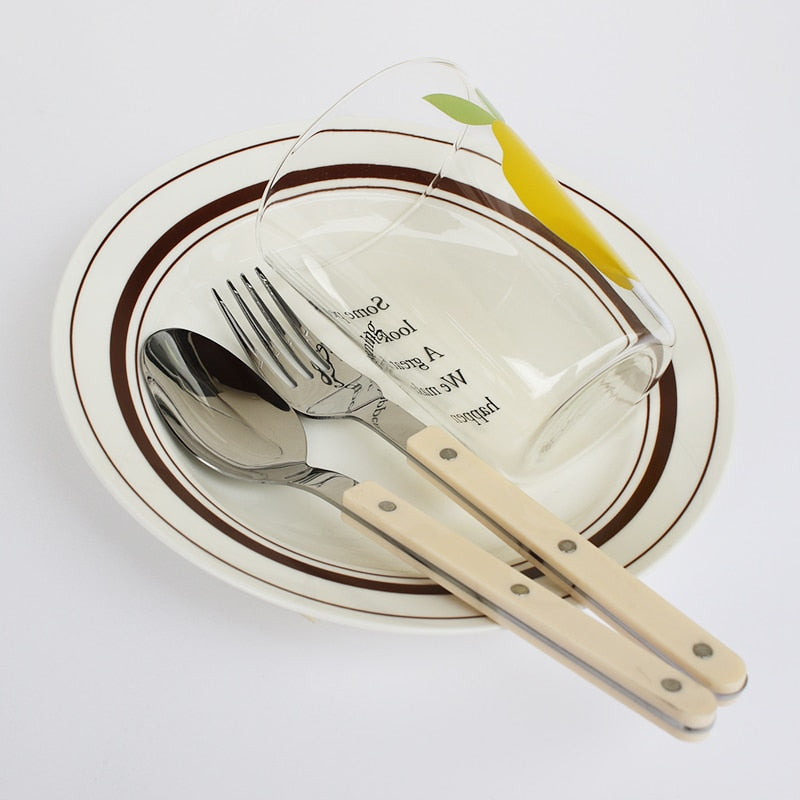 Sophisticated 24-piece engraved stainless steel cutlery for elegant kitchenware and dining.