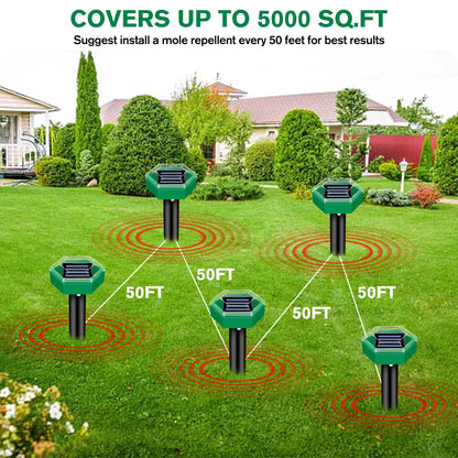 Close-up of a solar powered ultrasonic mole repellent spike in a lawn. Part of a 4-pack for yard protection.