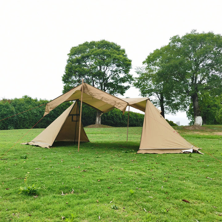 Durable 4-season camping tent pitched in a snowy landscape, showcasing windproof design.