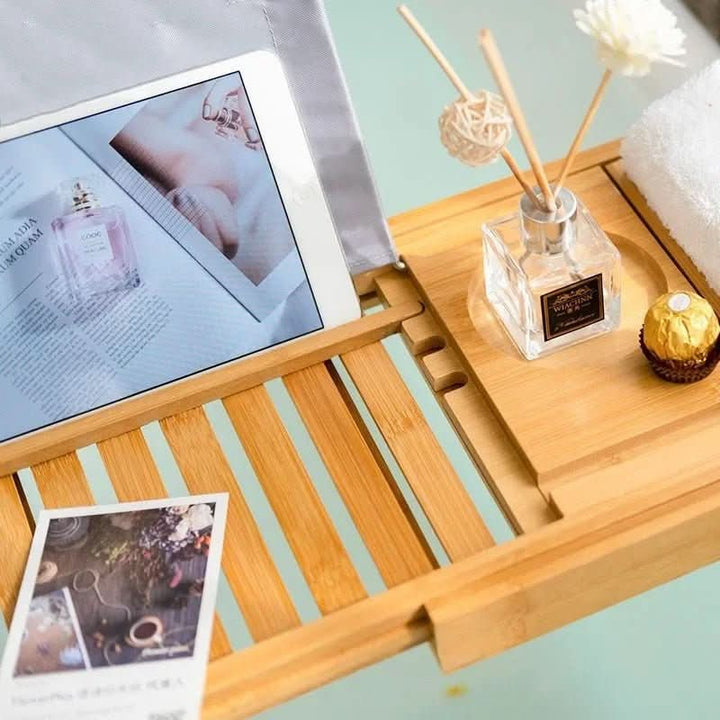 Eco-friendly bamboo bath tray, holds books, wine, & essentials for ultimate spa relaxation. Adjustable design.