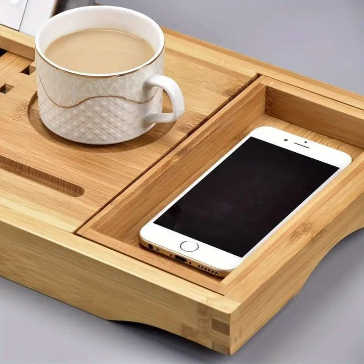 Luxurious adjustable bamboo bath organizer; perfect for a relaxing spa experience at home. Holds tablet & wine.