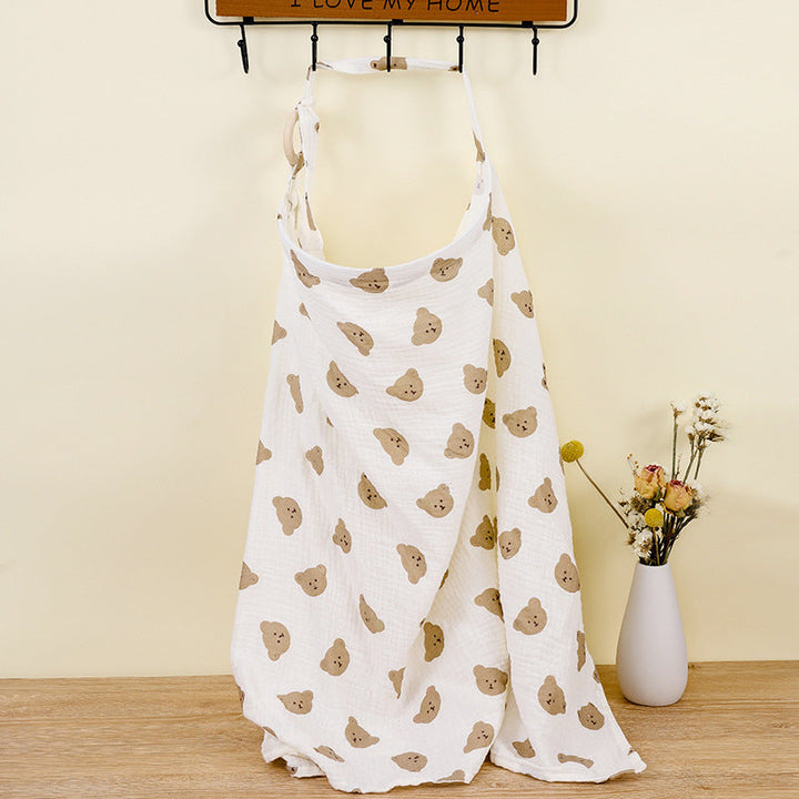 Versatile adjustable cotton nursing cover, also functions as a stroller blanket. New mom essential.