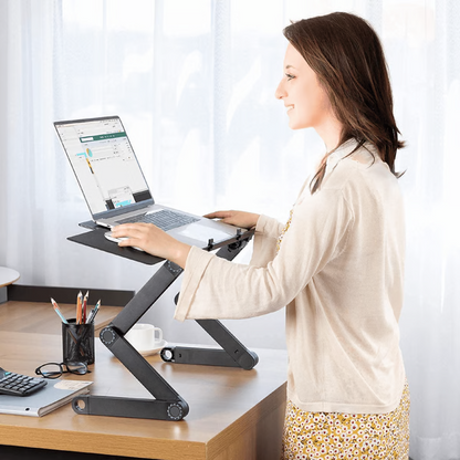 Adjustable ergonomic laptop stand with detachable mouse pad for a comfortable desk workstation setup.